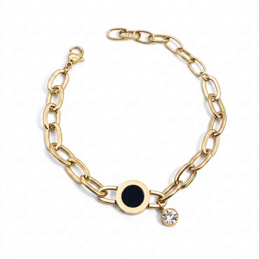 Goldfarbenes Damen-Armband aus Edelstahl mit weiten Kettengliedern, einer runden, schwarzen Einlage und einem hängenden Zirkonia-Stein, Hauptfoto
