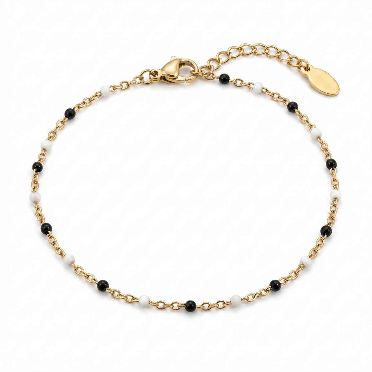 Filigranes goldfarbenes Damen-Armband aus Edelstahl, besetzt mit kleinen schwarz-weißen Perlen-Akzenten, Hauptfoto