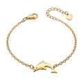 Goldfarbenes Damen-Armband aus Edelstahl mit einem grazilen Delfin-Anhänger, Hauptfoto