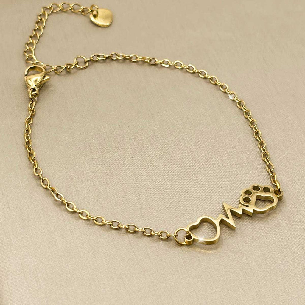 Goldfarbenes Damen-Armband aus Edelstahl mit integriertem Herz-Motiv, Herzfrequenz-Linie und Hundepfote, Produktfoto.
