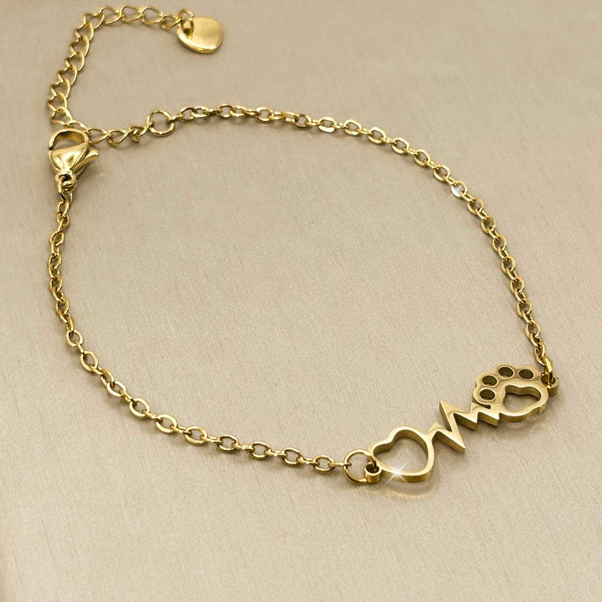 Goldfarbenes Damen-Armband aus Edelstahl mit integriertem Herz-Motiv, Herzfrequenz-Linie und Hundepfote, Produktfoto.
